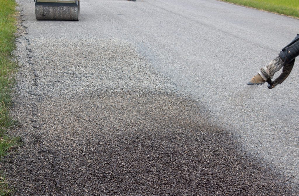 pothole repair being spray patched in alberta